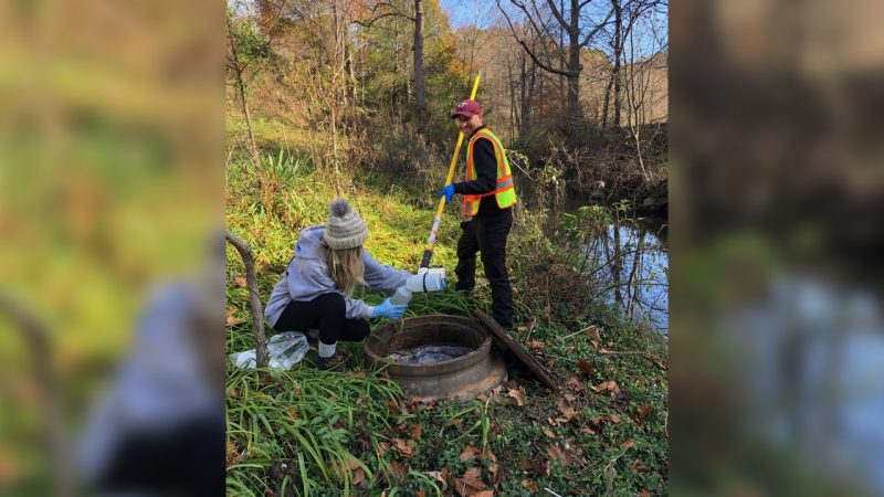 Two people testing water in rural Appalachia.